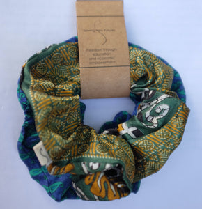 green scrunchie sewn from vintage sari fabric