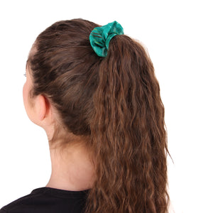 women with brown hair wearing blue-green scrunchie in ponytail