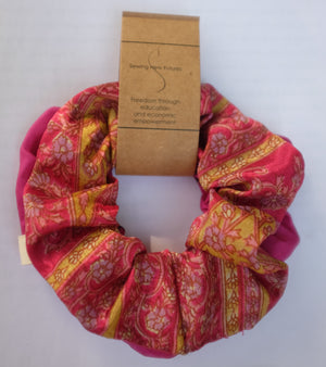Pink scrunchie set made from sari fabric in India